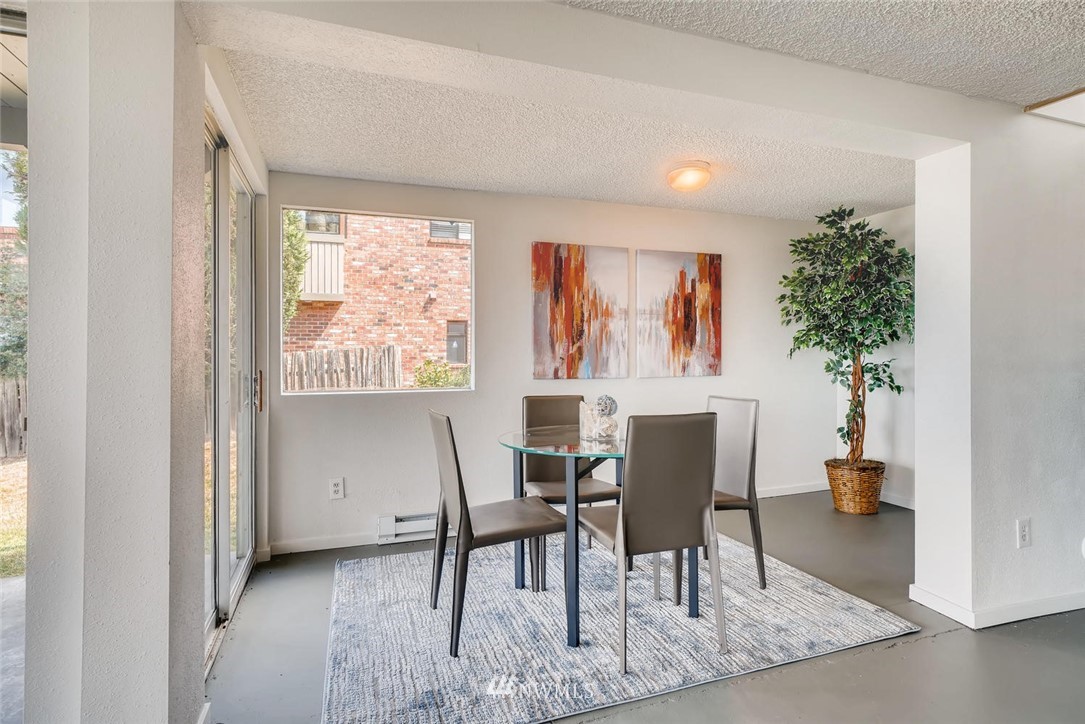 5633 Beach Drive Southwest Seattle, WA 98136 - Photo 13 of 25 a workspace room with furniture and a potted plant