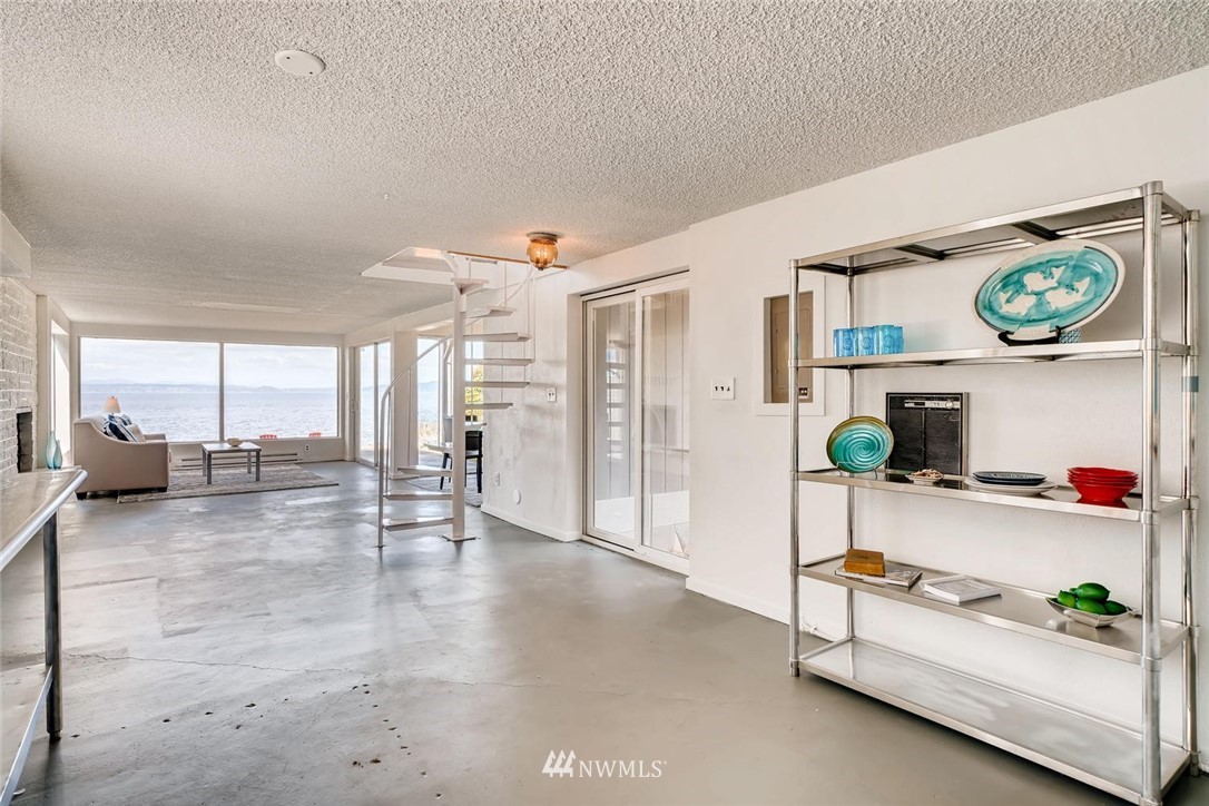 5633 Beach Drive Southwest Seattle, WA 98136 - Photo 17 of 25 a living room with furniture and a table