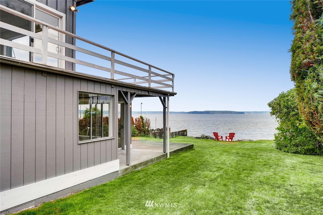 5633 Beach Drive Southwest Seattle, WA 98136 - Photo 19 of 25 a view of a house with a yard