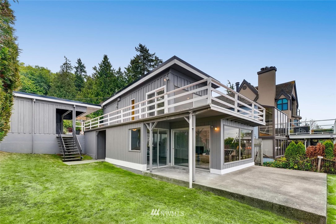5633 Beach Drive Southwest Seattle, WA 98136 - Photo 23 of 25 a view of a house with a yard and plants