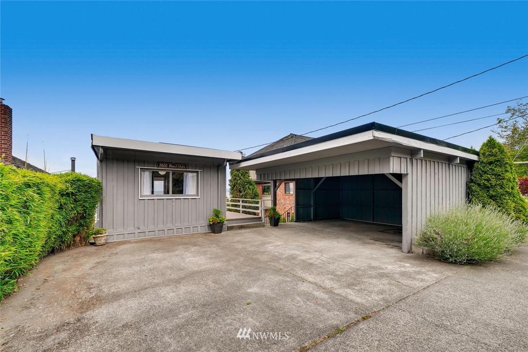 5633 Beach Drive Southwest Seattle, WA 98136 - Photo 4 of 25 a view of a house with an outdoor space and garage