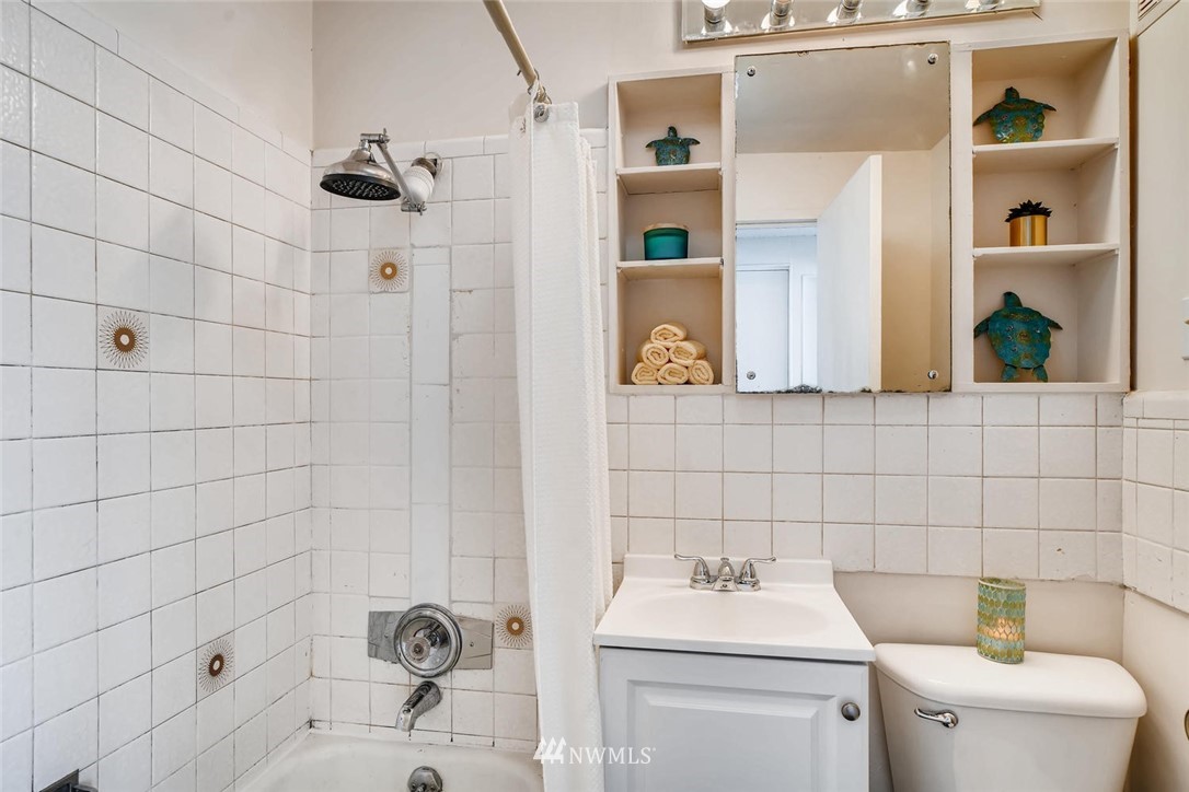 5633 Beach Drive Southwest Seattle, WA 98136 - Photo 9 of 25 a bathroom with a sink toilet and shower
