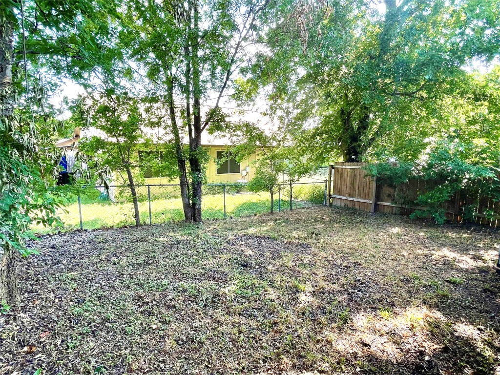 1802 Prairie Knoll Court, Unit B Austin, TX 78758 - Photo 9 of 10 a view of a backyard with trees