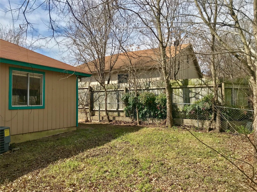 1802 Prairie Knoll Court, Unit B Austin, TX 78758 - Photo 10 of 10 a view of a house with a yard