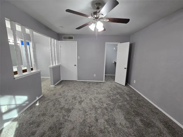 a view of an empty room with a fireplace