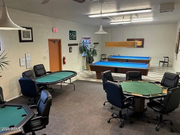 a living room with furniture and a rug