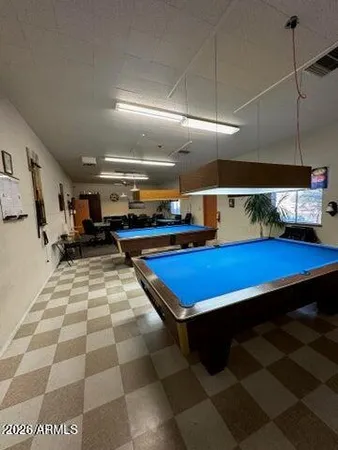 a room with lots of furniture and lots of mirrors