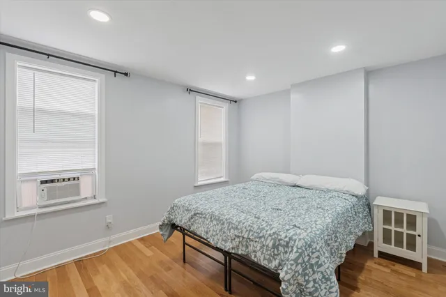 a room with a bed and a window