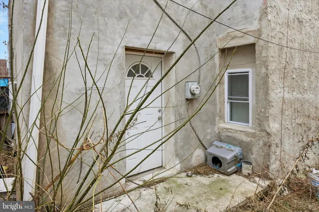 a view of a backyard with sitting area