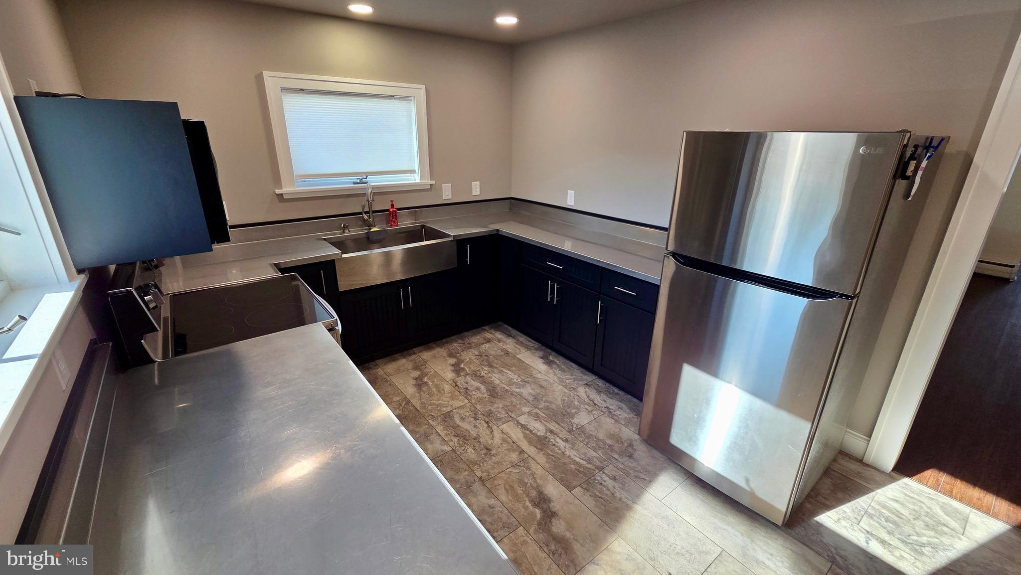 1074 Highway 103 Mount Union, PA 17066 - Photo 23 of 69 a kitchen with a refrigerator and a sink