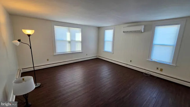 a view of wooden floor in an empty room