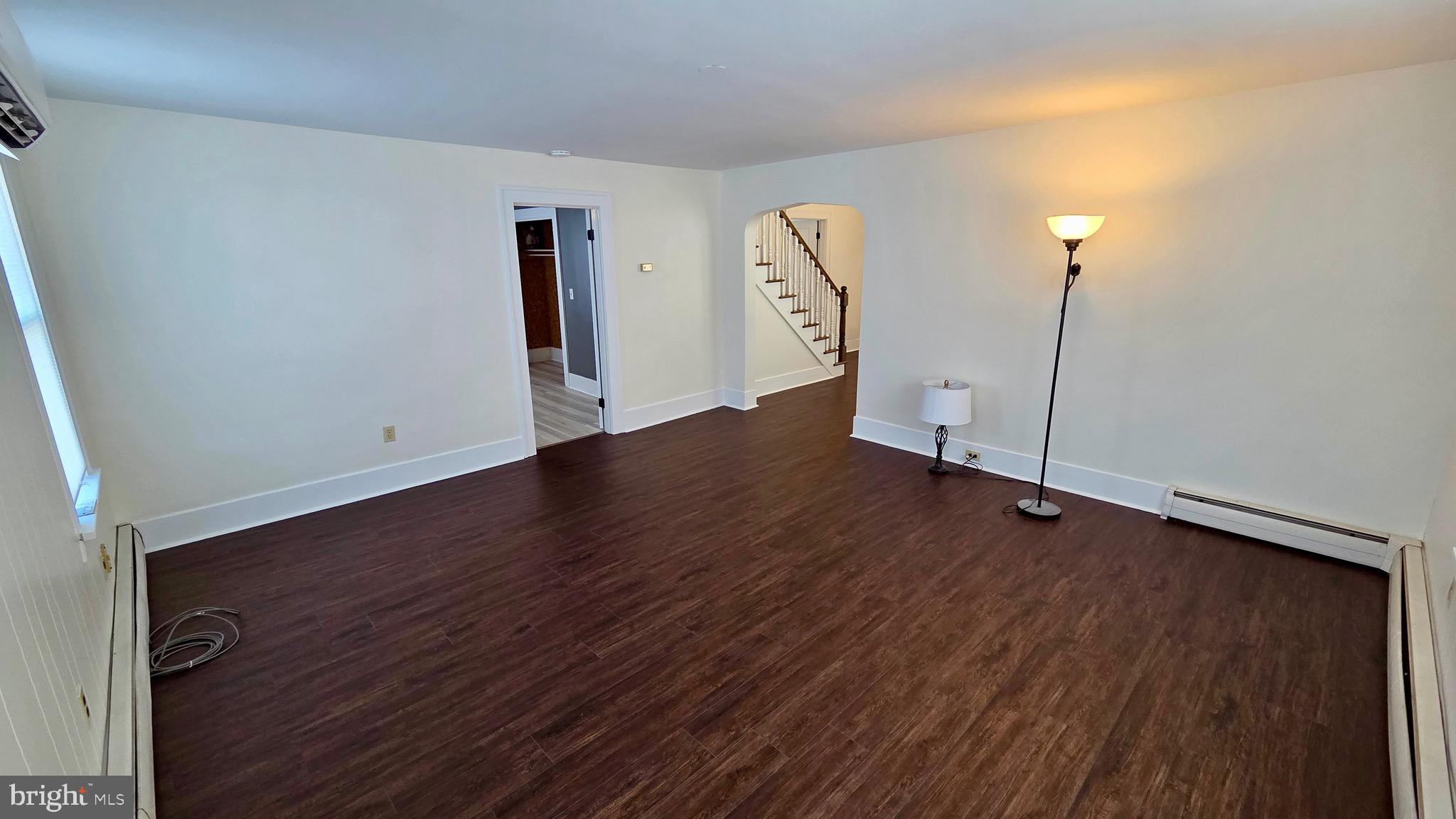 1074 Highway 103 Mount Union, PA 17066 - Photo 31 of 69 an empty room with wooden floor and windows