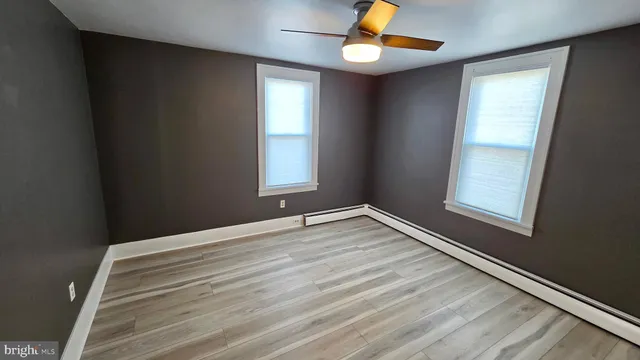 a view of gallery with wooden floor