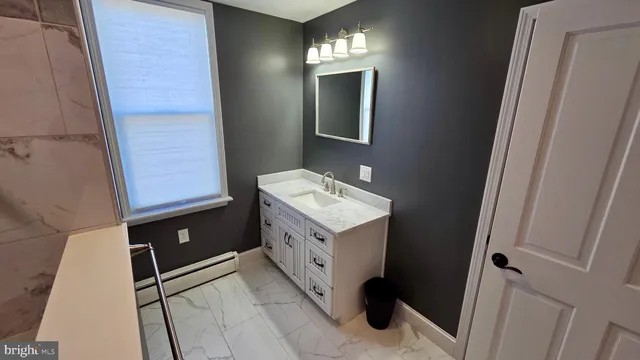 a close up of a sink and a mirror