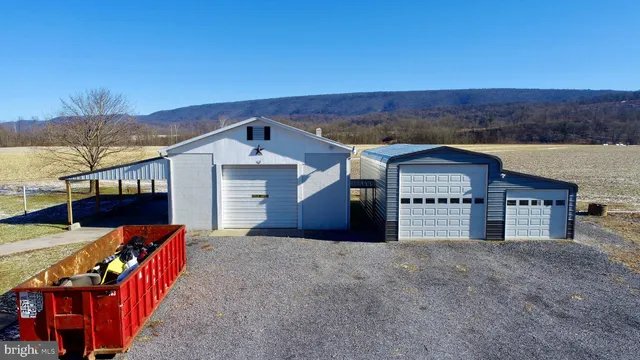 a view of a house with wooden deck