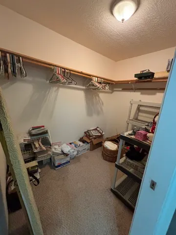 a room with a wooden floor and shoes
