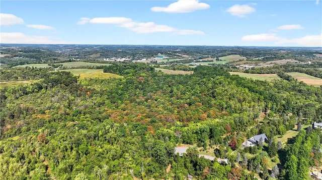 an aerial view of residential building with green space