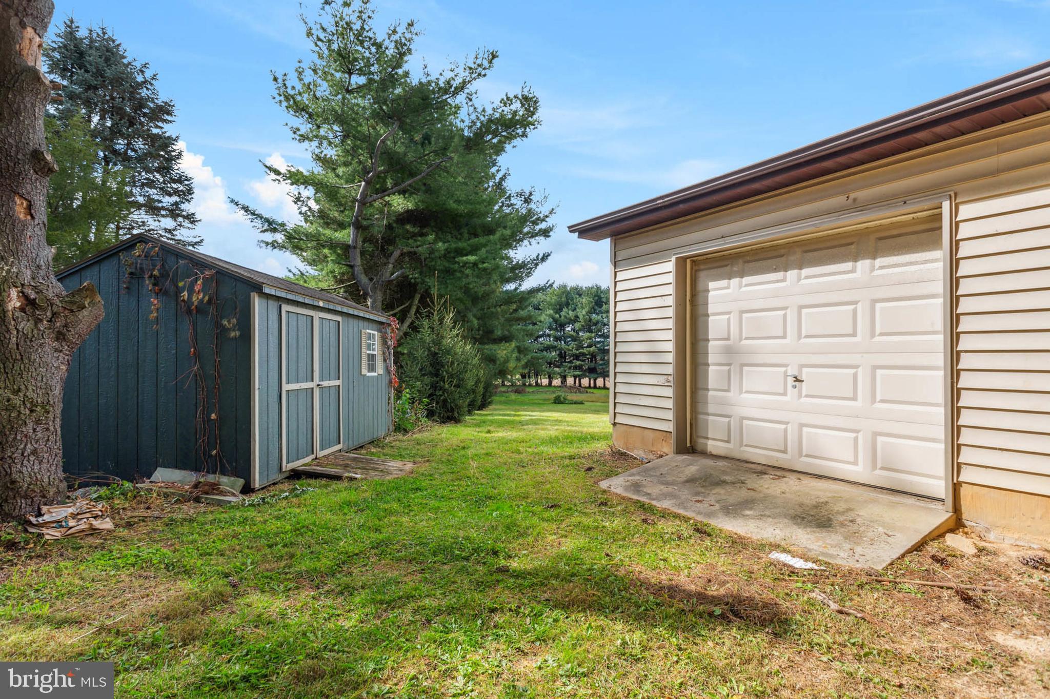4226 Wolf Hill Drive Hampstead, MD 21074 - Photo 32 of 44 Side garage for lawn mower/tractor!