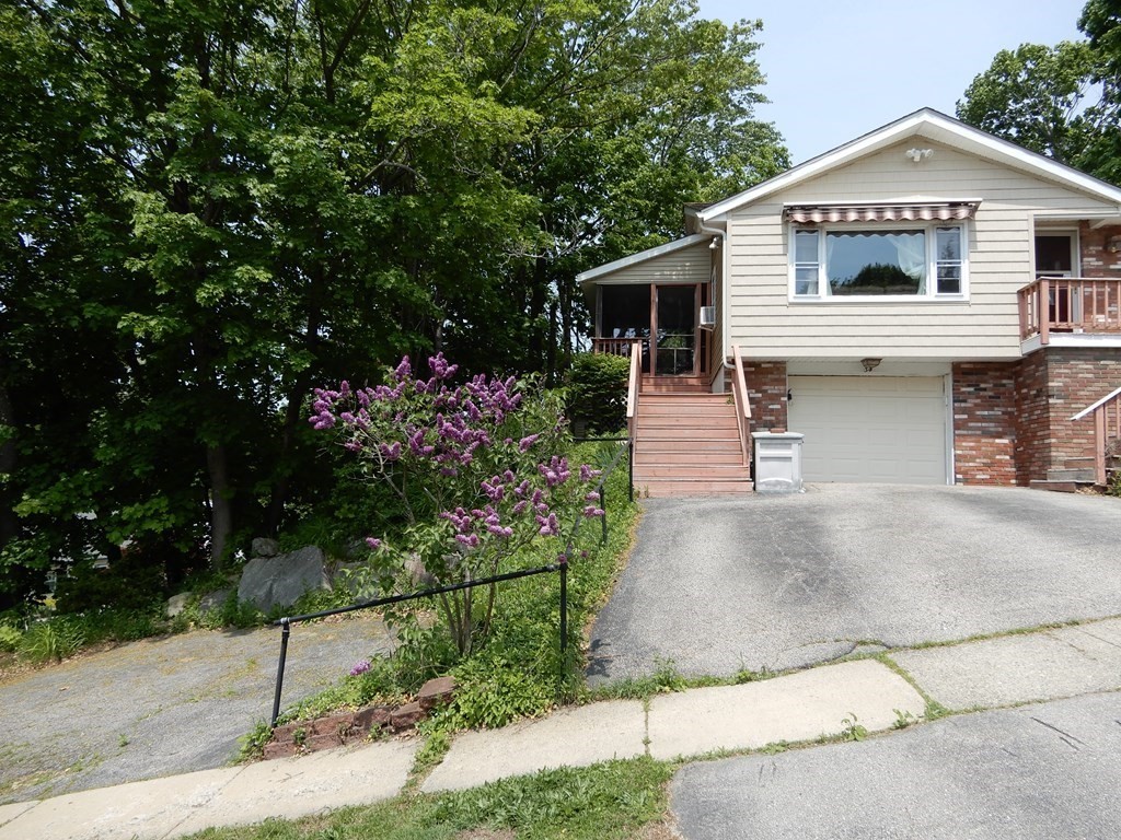 34 Colonial Road Worcester, MA 01602 - Photo 2 of 34 a front view of a house with a garden
