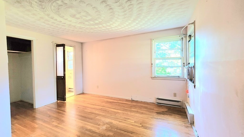 34 Colonial Road Worcester, MA 01602 - Photo 23 of 34 an empty room with wooden floor and windows