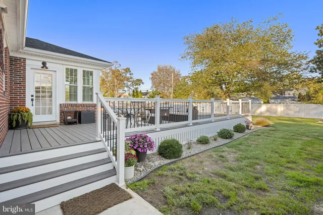 a view of a porch with furniture and garden