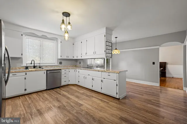 a kitchen with sink cabinets and window