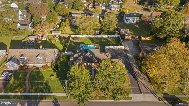 an aerial view of a residential apartment building with a yard
