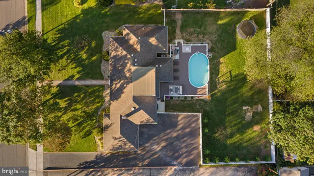 an aerial view of a house with swimming pool