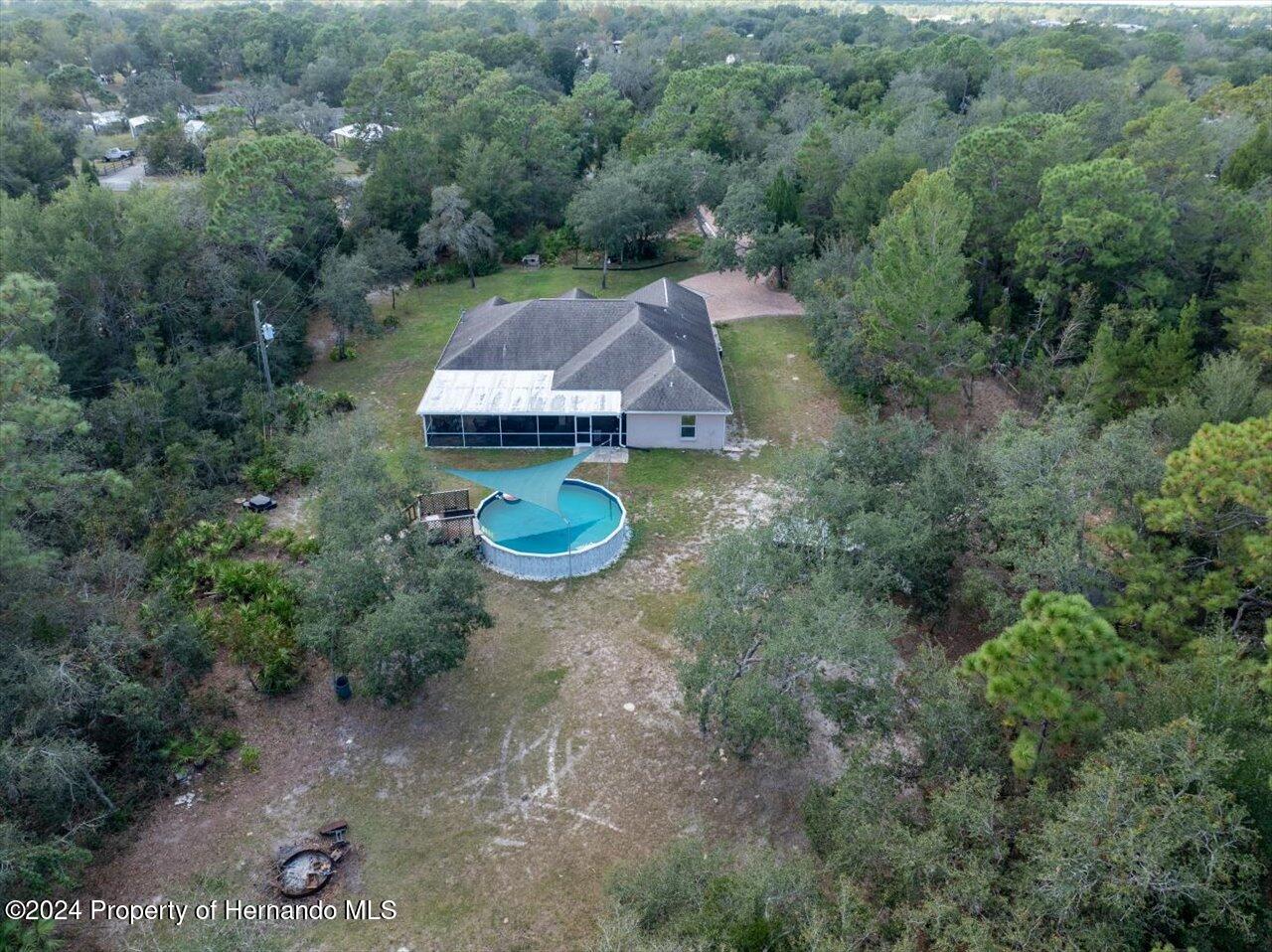 8108 Indian Trail Road Weeki Wachee, FL 34613 - Photo 54 of 59 an aerial view of a house with outdoor space