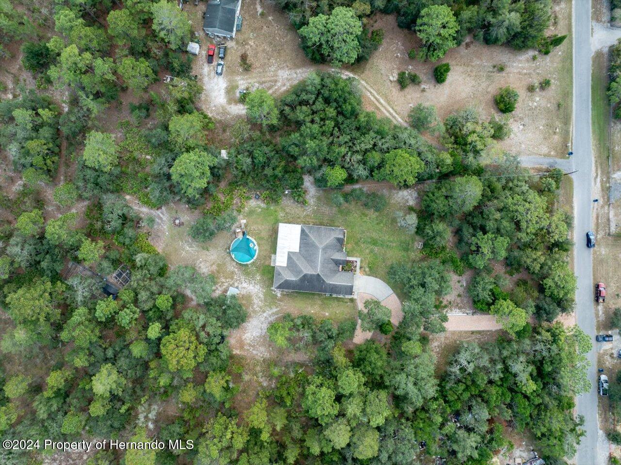 8108 Indian Trail Road Weeki Wachee, FL 34613 - Photo 59 of 59 an aerial view of a house with a yard