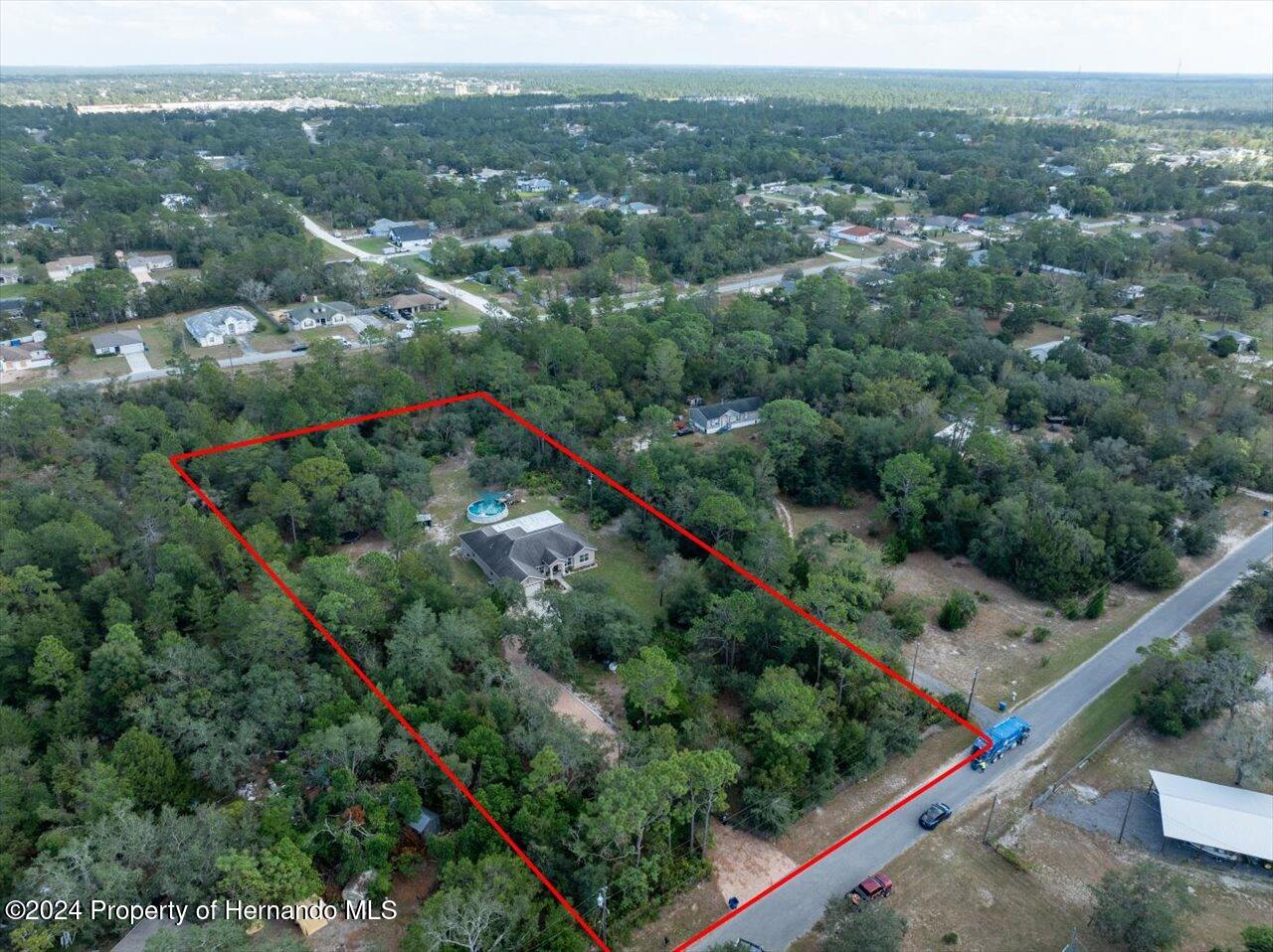 8108 Indian Trail Road Weeki Wachee, FL 34613 - Photo 9 of 59 an aerial view of a city