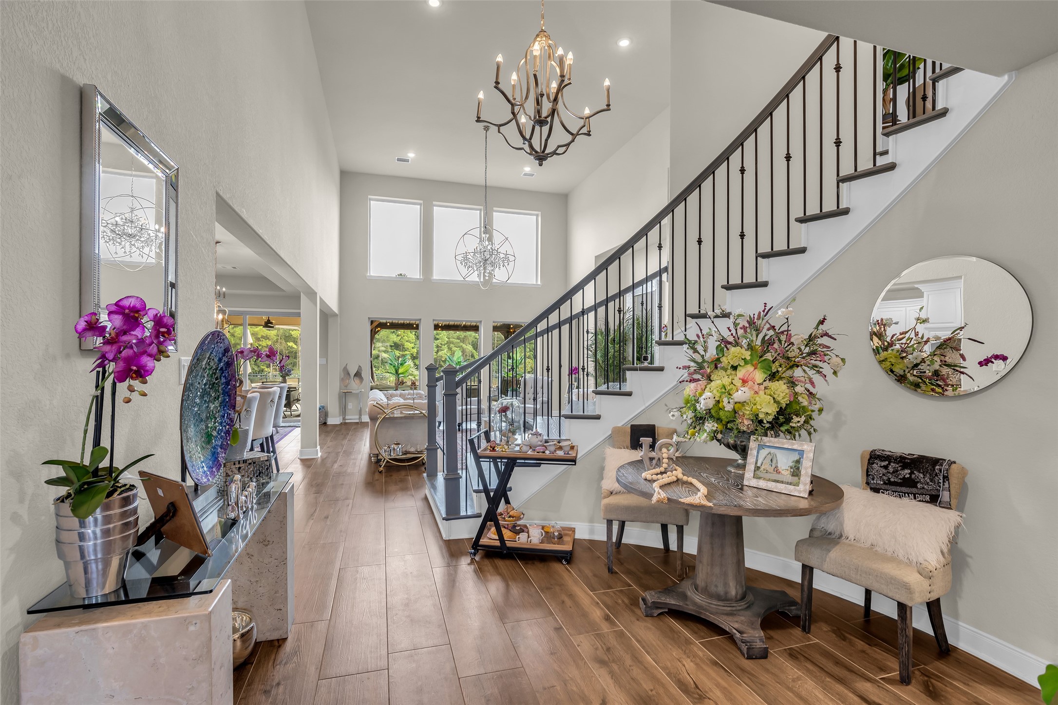 7211 Julie Pond Lane Spring, TX 77389 - Photo 8 of 45 Elegant entryway with high ceilings, a grand chandelier, and a sweeping staircase.