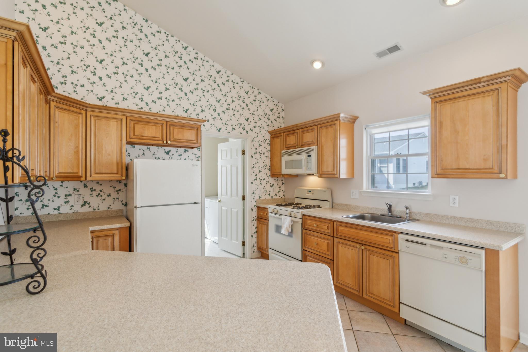 104 Trellis Lane Sewell, NJ 08080 - Photo 13 of 28 a kitchen with stainless steel appliances a sink stove and refrigerator
