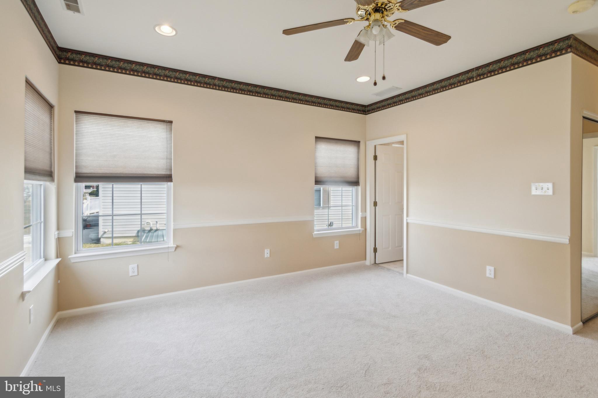 104 Trellis Lane Sewell, NJ 08080 - Photo 23 of 28 an empty room with windows and fan