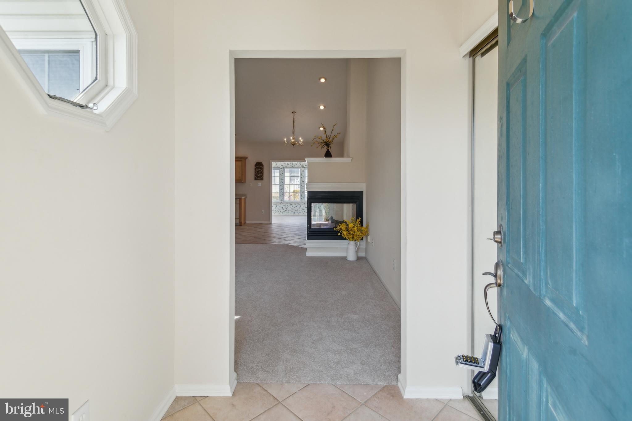 104 Trellis Lane Sewell, NJ 08080 - Photo 5 of 28 a view of a hallway with wooden floor and a bathroom