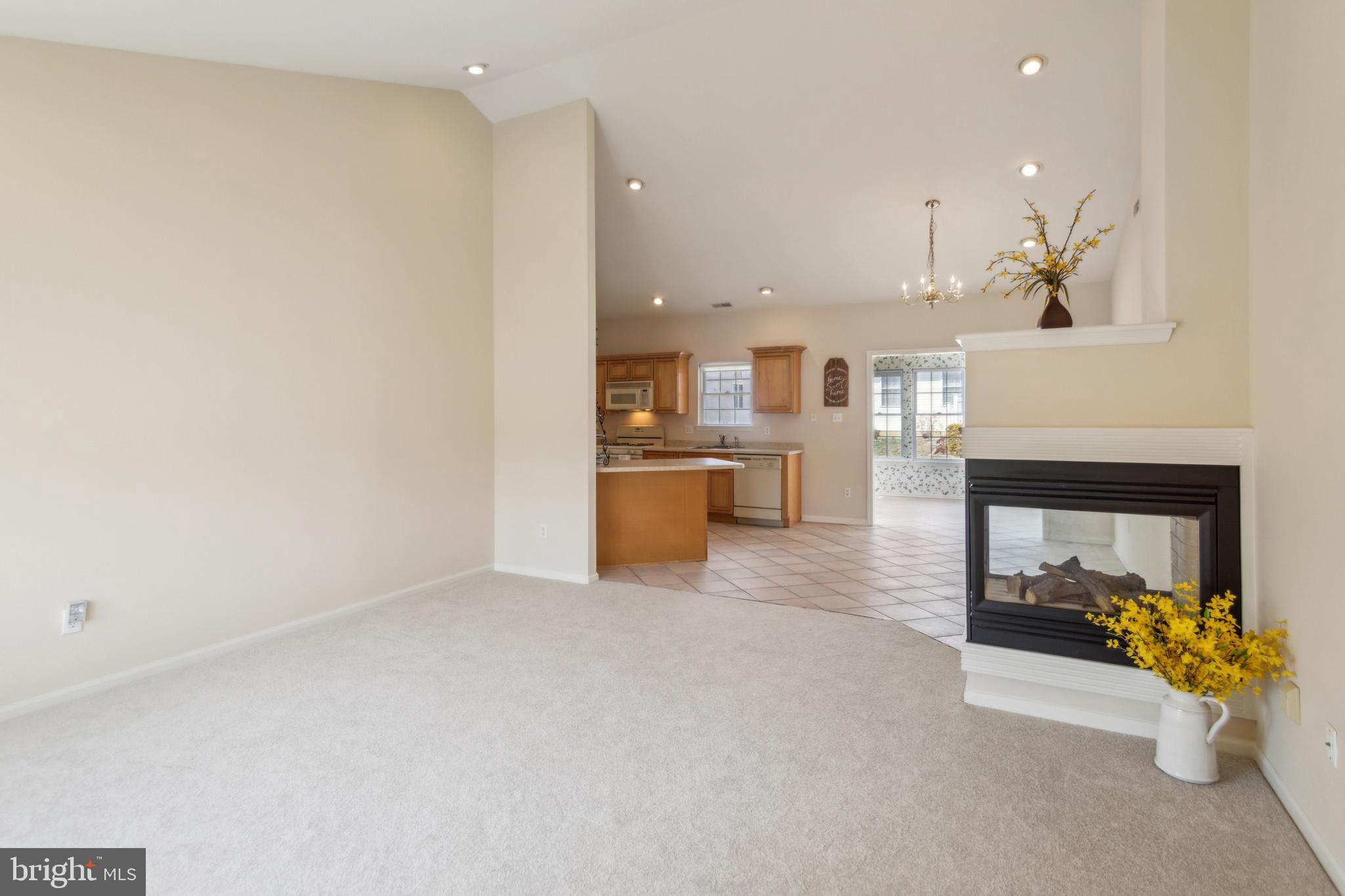 104 Trellis Lane Sewell, NJ 08080 - Photo 6 of 28 a view of a living room and a kitchen with a sink