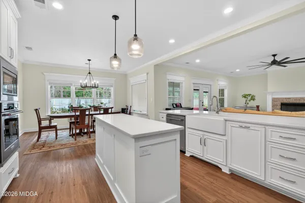 a view of a dining room with furniture and window