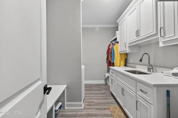 a bathroom with a sink and a window