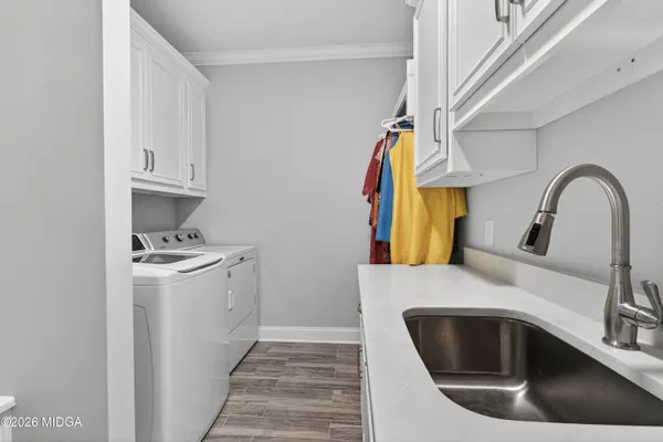 a white bath tub sitting in a bathroom next to a window