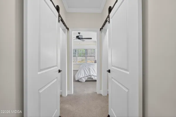 a bathroom with a granite countertop sink a mirror and shower