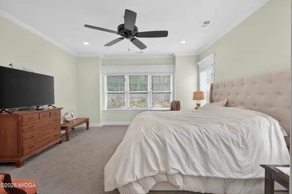 a bedroom with a bed and furniture