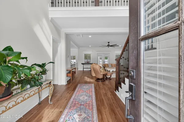 a view of entryway with wooden floor and a potted plant