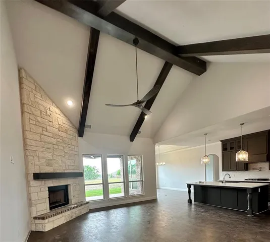 a view of living room with furniture and fireplace