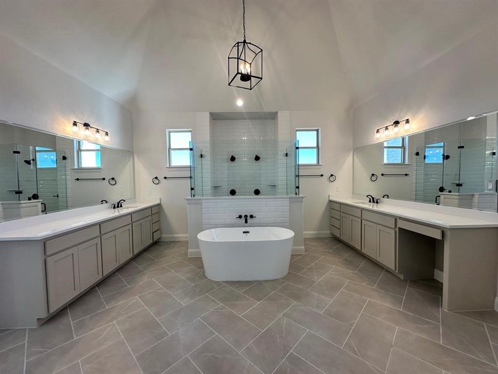124 Blackstar Lane Decatur, TX 76234 - Photo 20 of 24 a bathroom with a double vanity sink mirror and bathtub