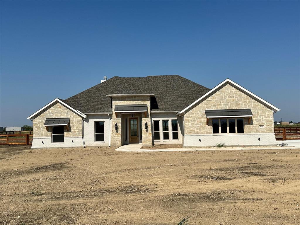 124 Blackstar Lane Decatur, TX 76234 - Photo 9 of 24 a front view of a house with a yard