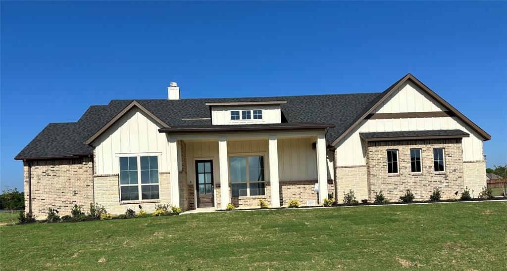 124 Blackstar Lane Decatur, TX 76234 - Photo 10 of 24 a front view of a house with a yard