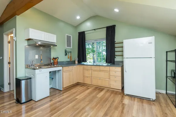 a view of an entryway door with wooden floor
