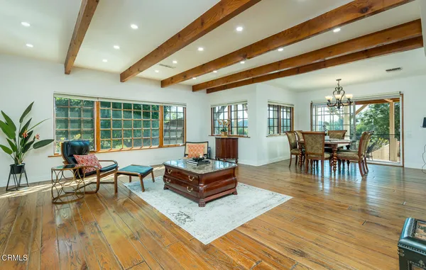 a workspace with furniture and a chandelier