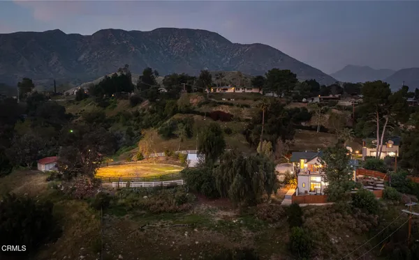 a view of a roadside with trees