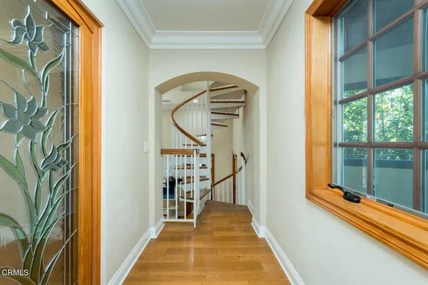 a view of a bedroom with furniture and a large window